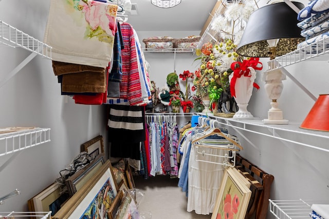 walk in closet featuring carpet