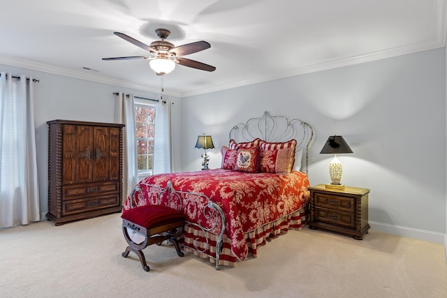 carpeted bedroom with ceiling fan and crown molding