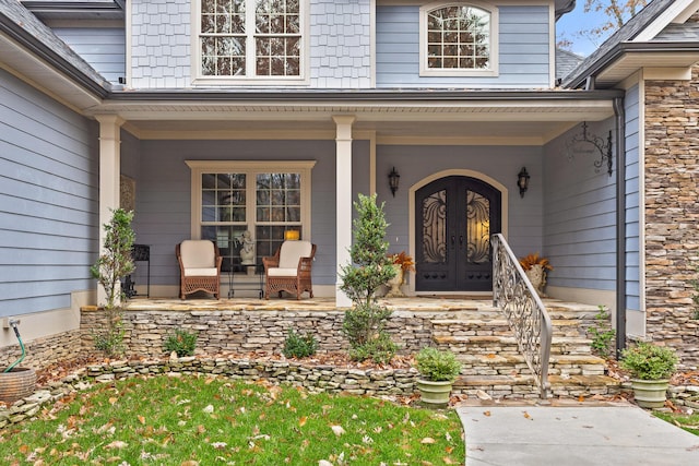 doorway to property with french doors and a porch