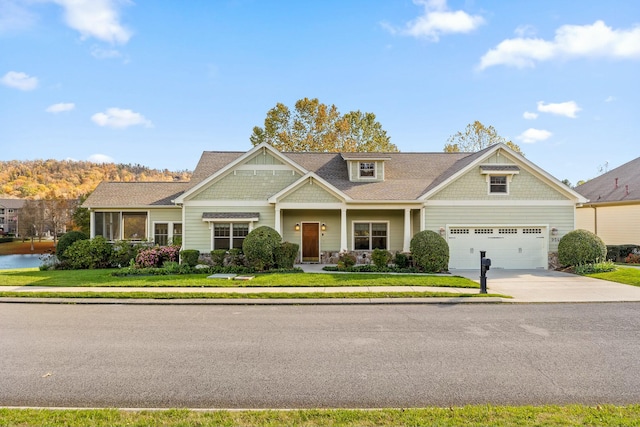 craftsman house with a front lawn and a garage