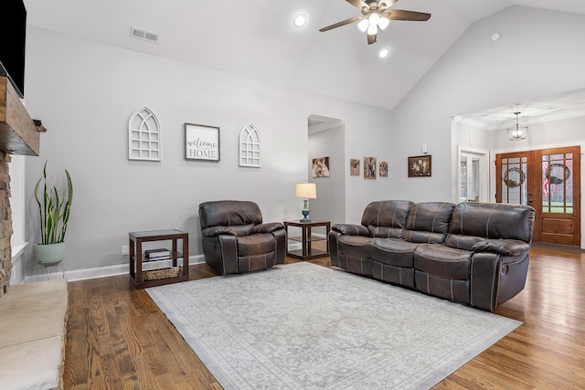 living room with french doors, ceiling fan, dark hardwood / wood-style floors, and high vaulted ceiling