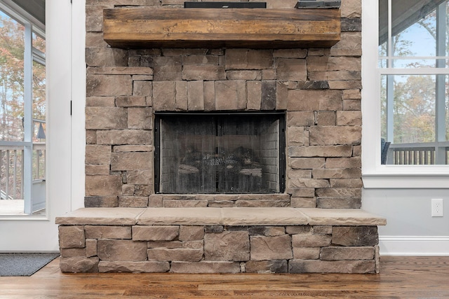 room details with a fireplace and hardwood / wood-style floors