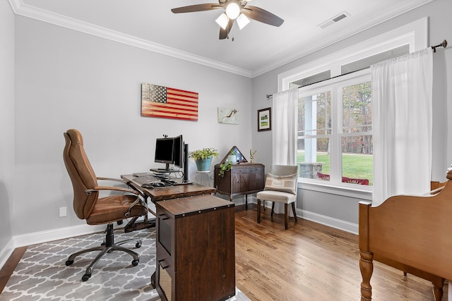 office area featuring ceiling fan, crown molding, and wood-type flooring