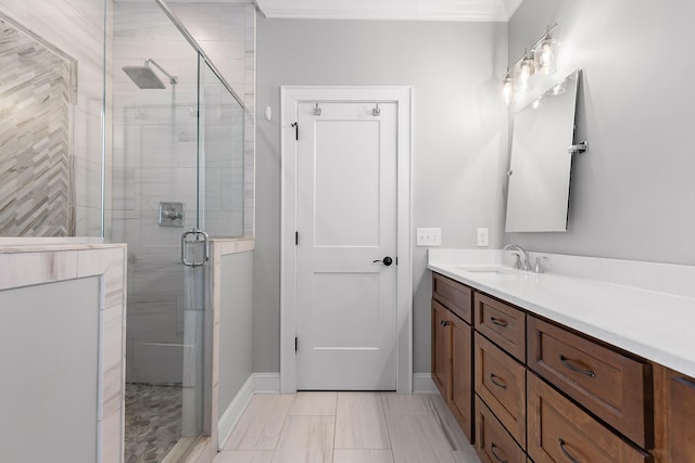 bathroom featuring walk in shower, vanity, and ornamental molding