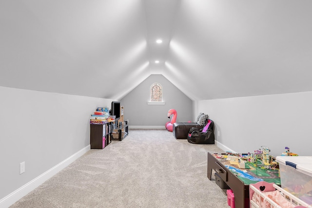 recreation room with carpet and lofted ceiling