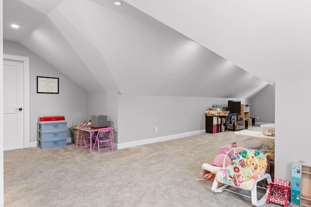 rec room featuring carpet floors and vaulted ceiling