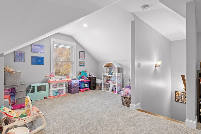 game room with vaulted ceiling and carpet flooring