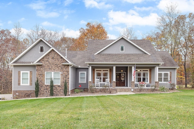 craftsman inspired home with a front yard and a porch