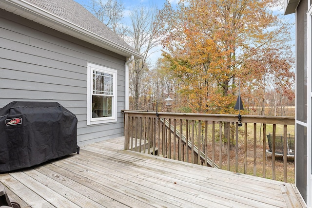 wooden terrace featuring area for grilling