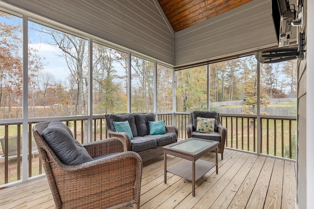 sunroom / solarium featuring vaulted ceiling and wooden ceiling