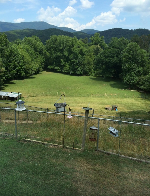 mountain view featuring a rural view