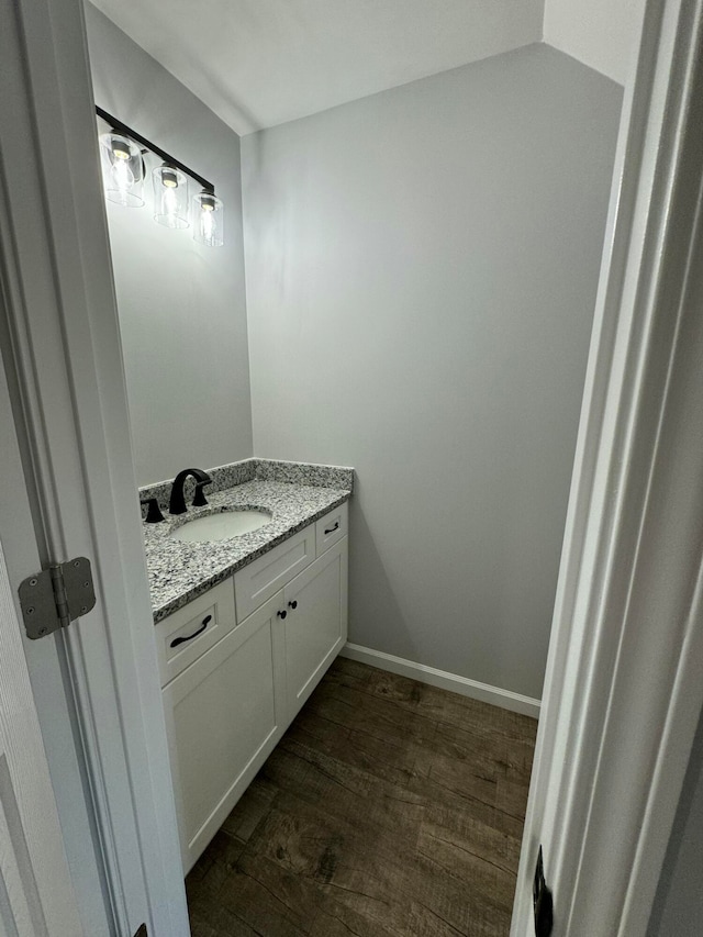 bathroom featuring vanity and hardwood / wood-style flooring