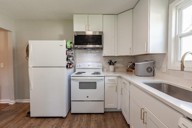 kitchen featuring sink, tasteful backsplash, dark hardwood / wood-style floors, white appliances, and white cabinets