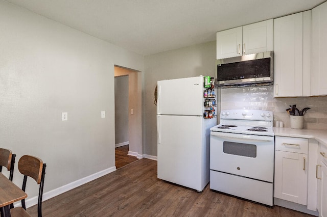 kitchen featuring decorative backsplash, white appliances, white cabinetry, and dark wood-type flooring