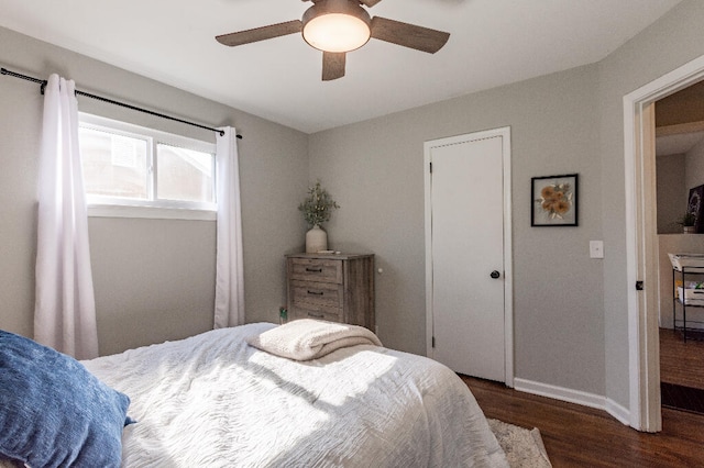 bedroom featuring ceiling fan and dark hardwood / wood-style floors