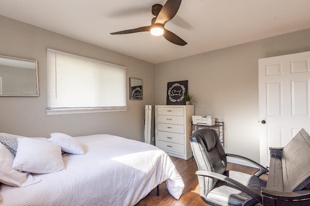 bedroom featuring ceiling fan and dark wood-type flooring