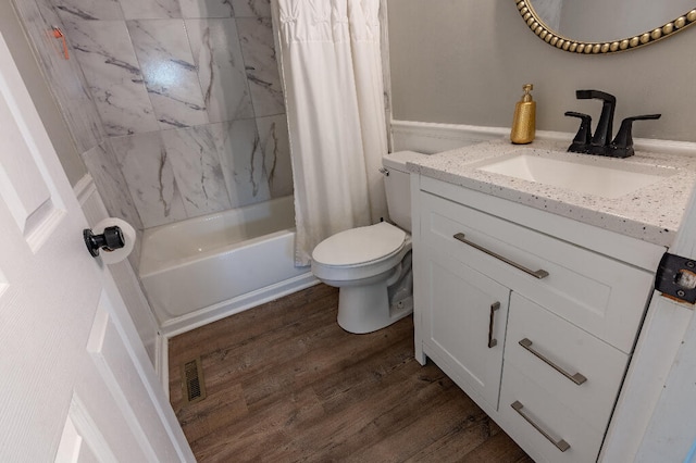 full bathroom with wood-type flooring, vanity, toilet, and shower / bath combo with shower curtain