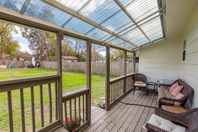 sunroom featuring vaulted ceiling