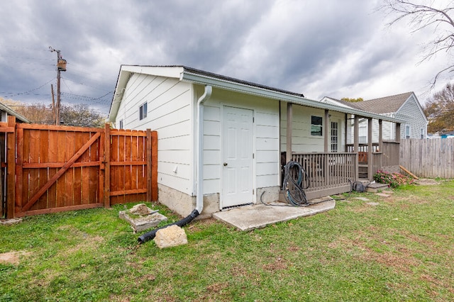 back of property featuring a lawn