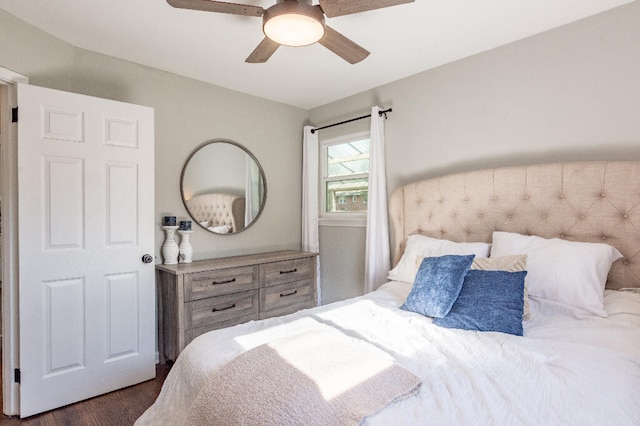 bedroom featuring dark hardwood / wood-style flooring and ceiling fan