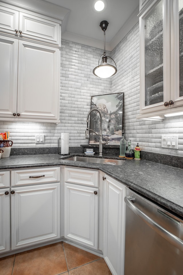 kitchen featuring dishwasher, white cabinetry, and hanging light fixtures