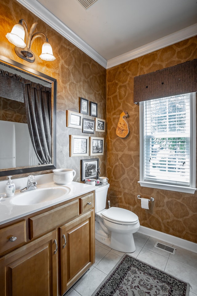 bathroom with crown molding, tile patterned flooring, vanity, and toilet