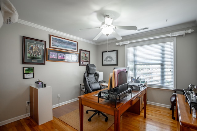 office area with light hardwood / wood-style floors, ceiling fan, and ornamental molding