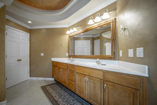 bathroom featuring tile patterned flooring, vanity, and ornamental molding