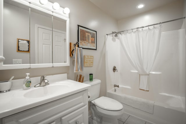 full bathroom with tile patterned floors, vanity, shower / tub combo, and toilet