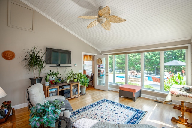 sunroom / solarium with wooden ceiling, plenty of natural light, lofted ceiling, and ceiling fan