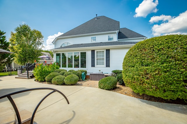 back of house with a patio