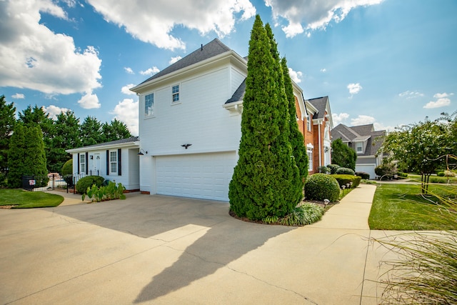 view of side of home featuring a garage