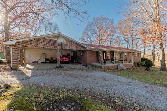 view of front facade with a porch and a carport