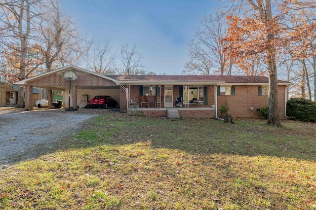 single story home featuring a carport, a porch, and a front yard