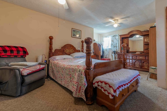 bedroom with a textured ceiling, ceiling fan, and light carpet