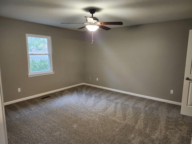 spare room with ceiling fan, carpet floors, and a textured ceiling