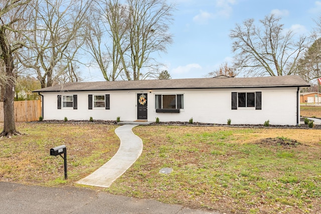 single story home with a front lawn