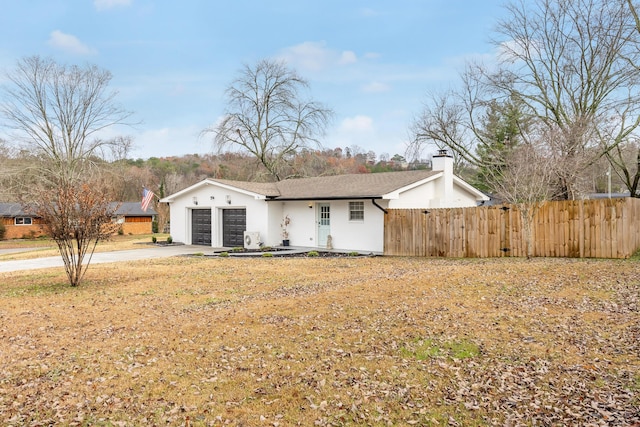 single story home featuring a garage