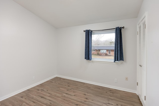 empty room featuring hardwood / wood-style flooring