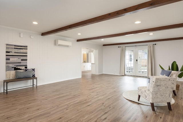 living area featuring a wall mounted air conditioner, french doors, wooden walls, hardwood / wood-style flooring, and beamed ceiling