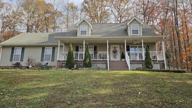 new england style home featuring a porch and a front yard