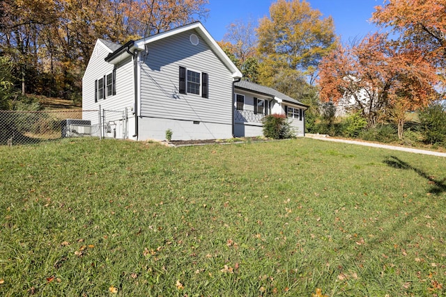 view of property exterior with a yard