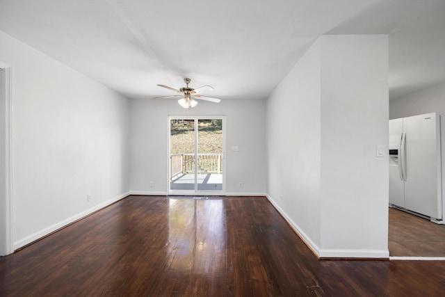 unfurnished room with dark hardwood / wood-style floors and ceiling fan