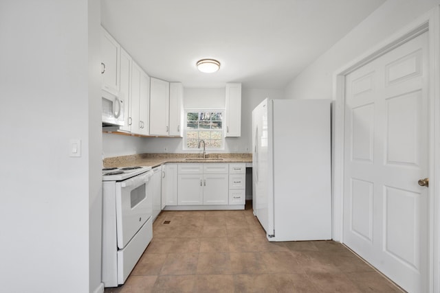 kitchen with white cabinetry, sink, light tile patterned floors, and white appliances