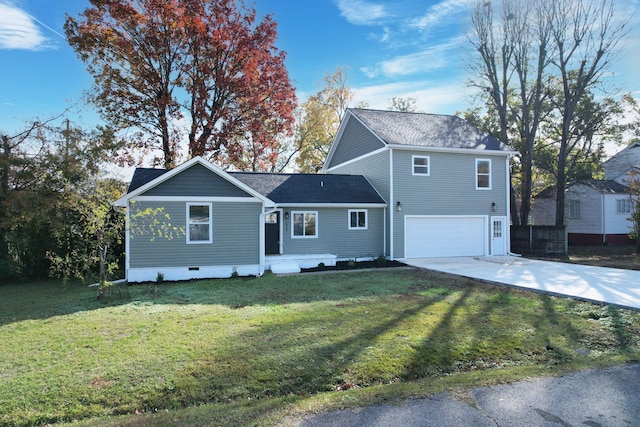 view of front of property with a garage and a front yard