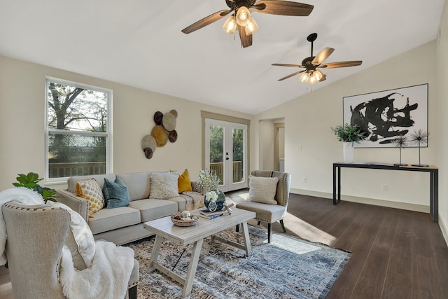 living room featuring french doors, a healthy amount of sunlight, dark hardwood / wood-style flooring, and lofted ceiling