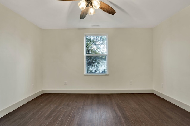 spare room featuring ceiling fan and dark hardwood / wood-style flooring