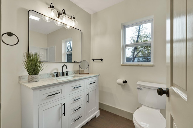 1024 Hurst St, East Ridge, TN 37412 - bathroom with toilet, healthy amount of natural light, vanity, and baseboards