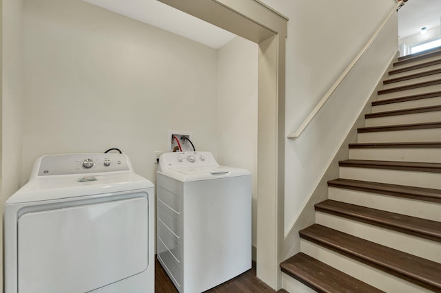 washroom with dark hardwood / wood-style floors and washer and dryer