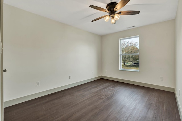 unfurnished room with ceiling fan and dark hardwood / wood-style floors